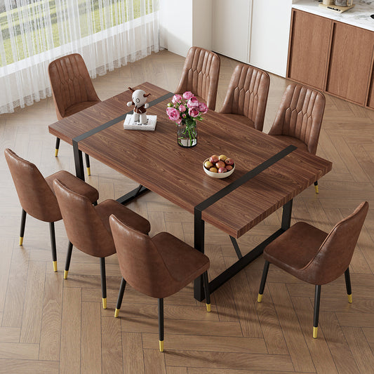 Dark wood dining table with a modern black base and eight brown leatherette chairs