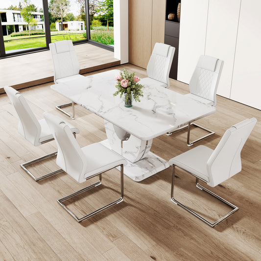 White faux leather dining chairs with diamondstitched backs around a modern marble dining table set