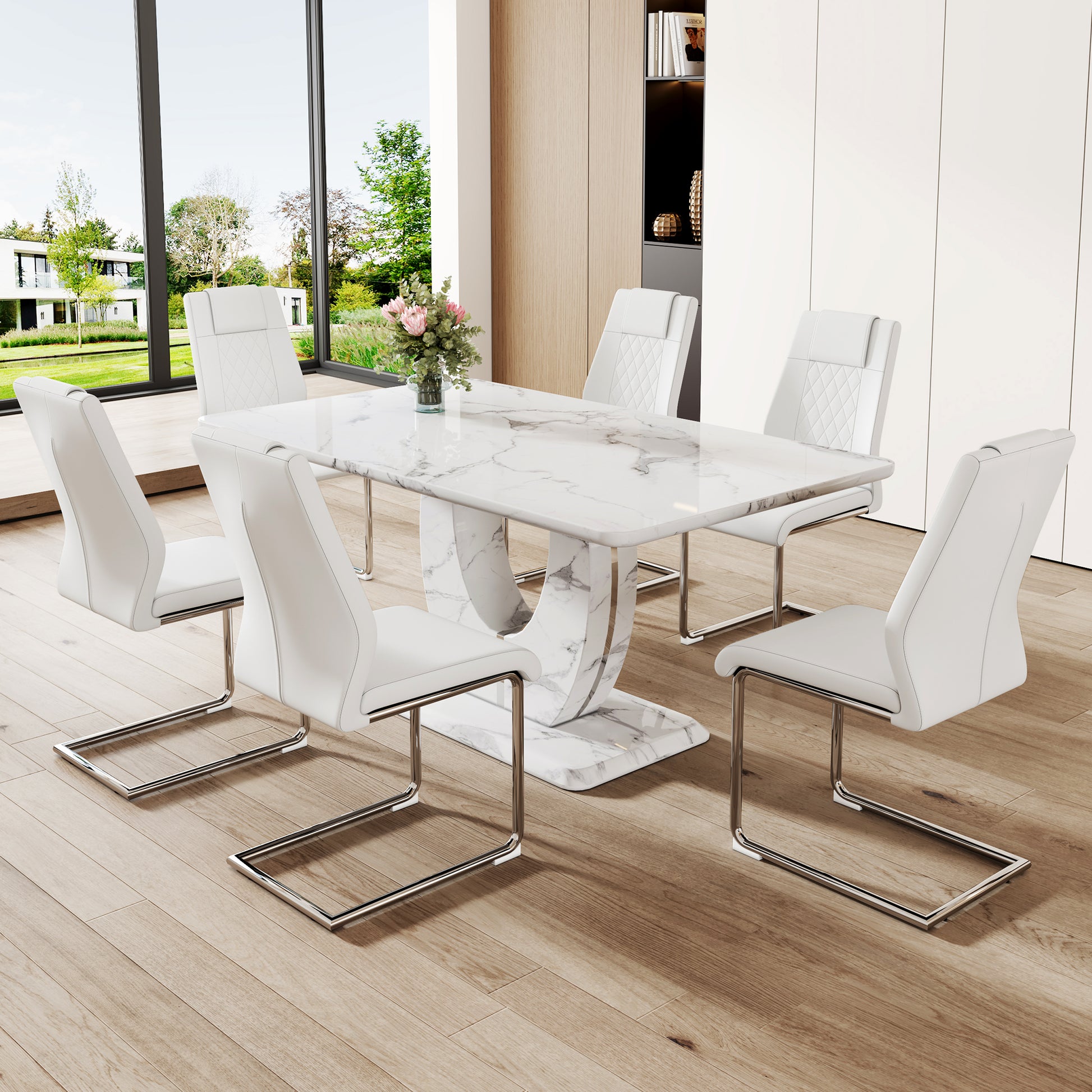 White faux leather dining chair with chrome sled legs and quilted back
