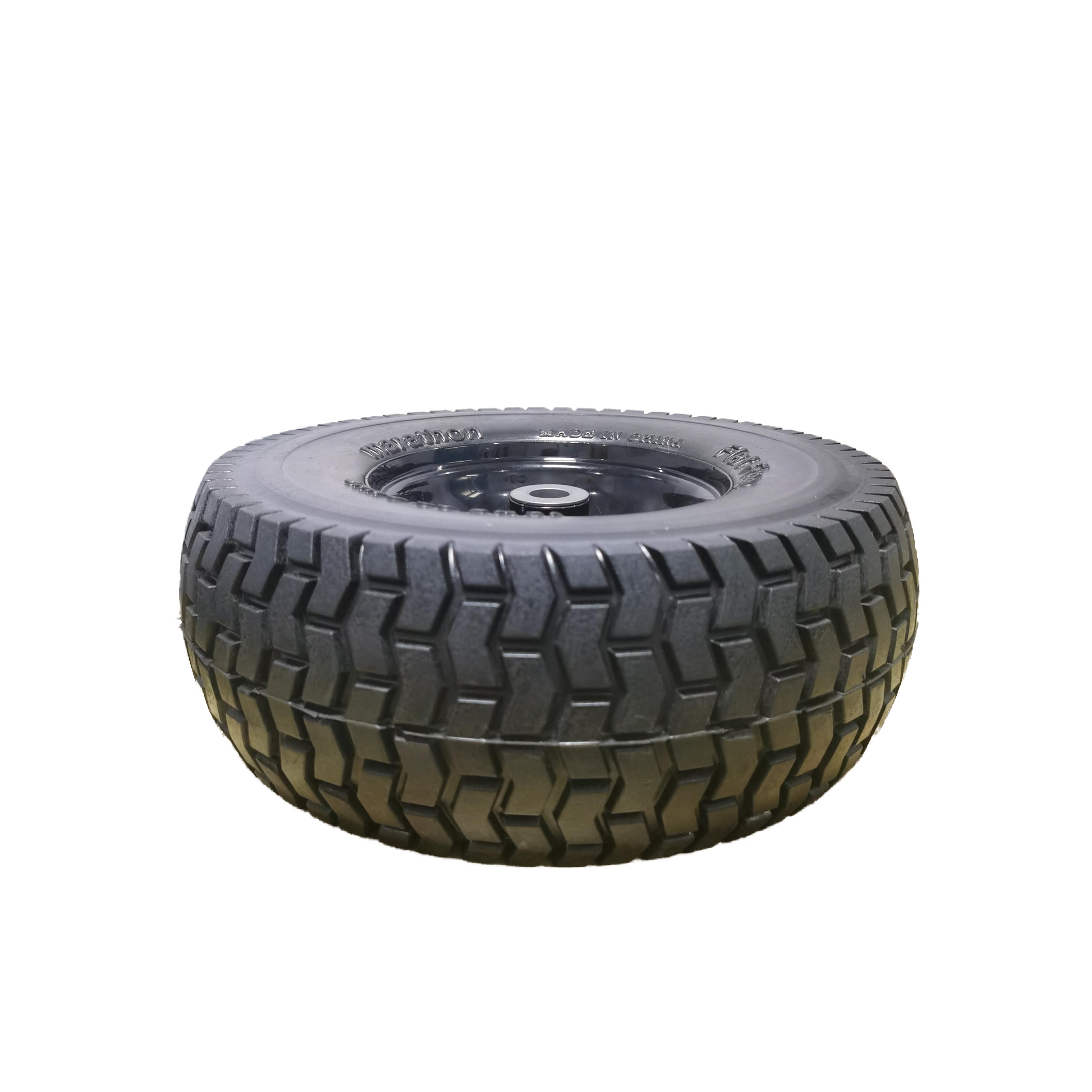 Heavyduty black tire with a deep tread pattern for offroad use