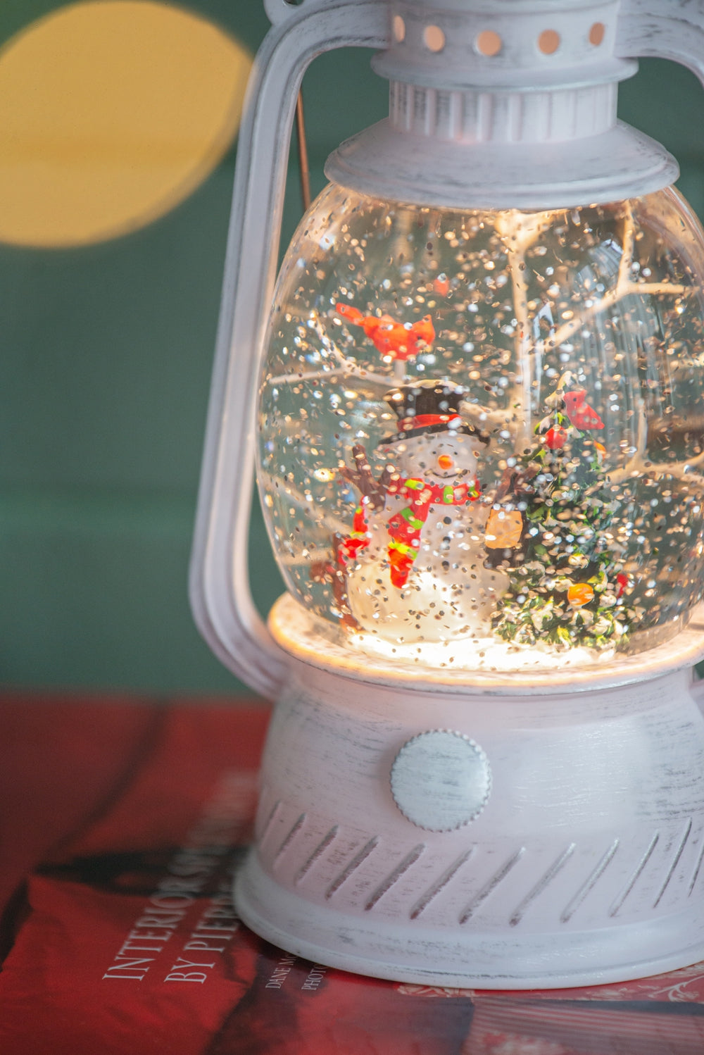 White lantern snow globe with snowman and cardinals