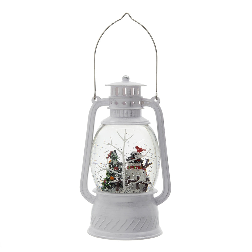 White snowman snow globe lantern with glittery trees and cardinal accent