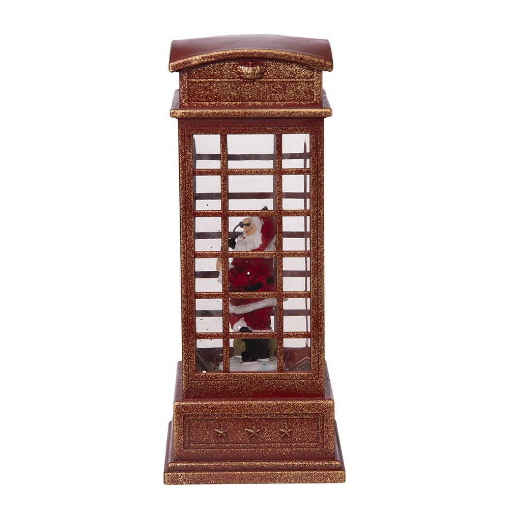Red vintage telephone booth lantern with Santa Claus inside