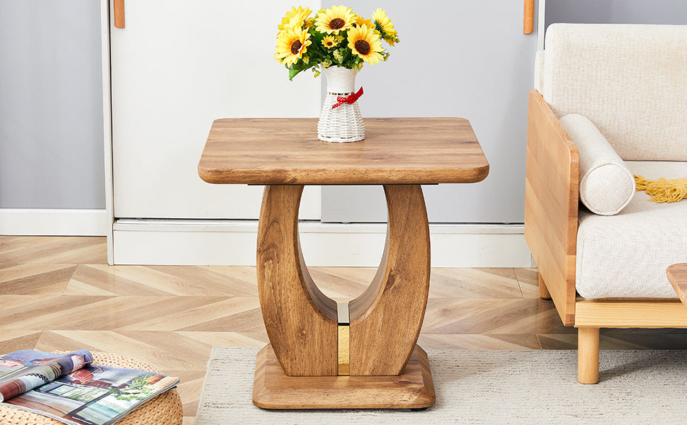 Wooden side table with curved base and floral decor