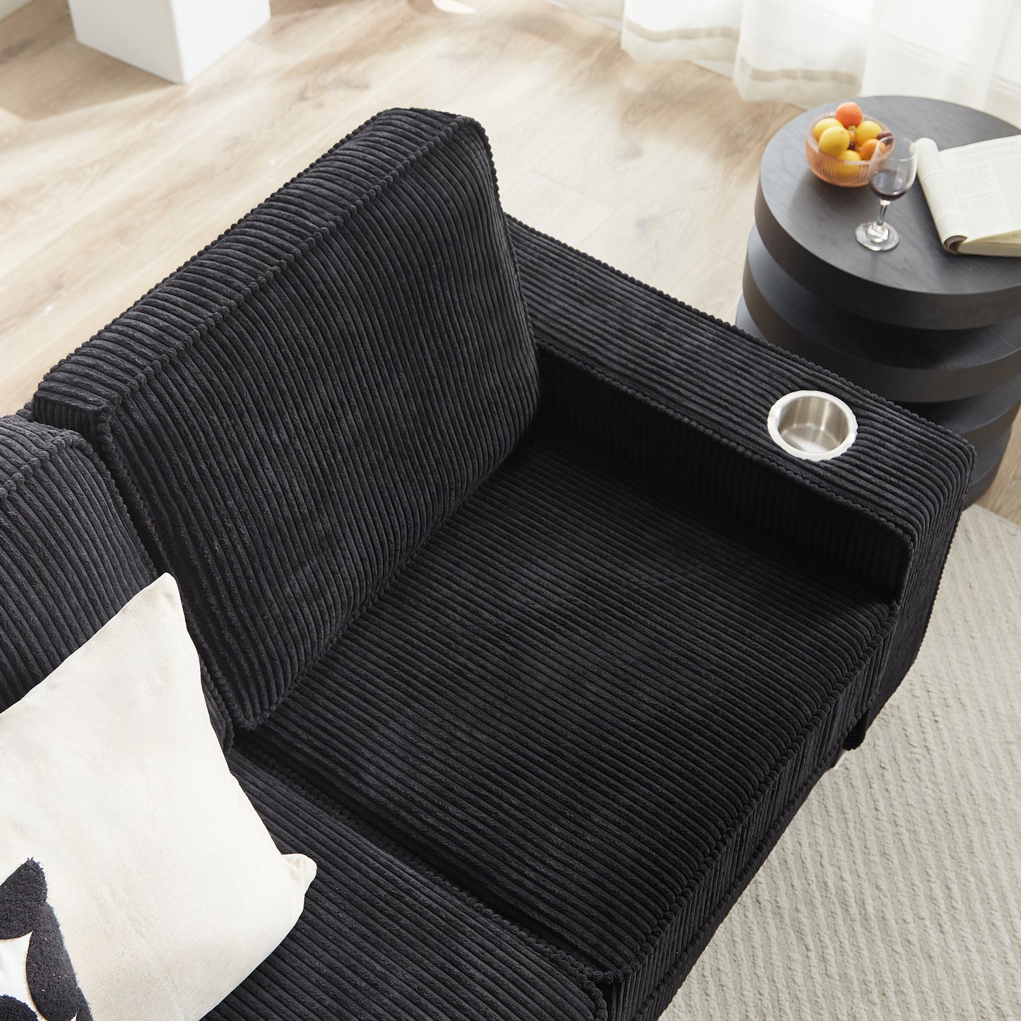 Black corduroy sofa sectional with builtin cup holder for movie nights