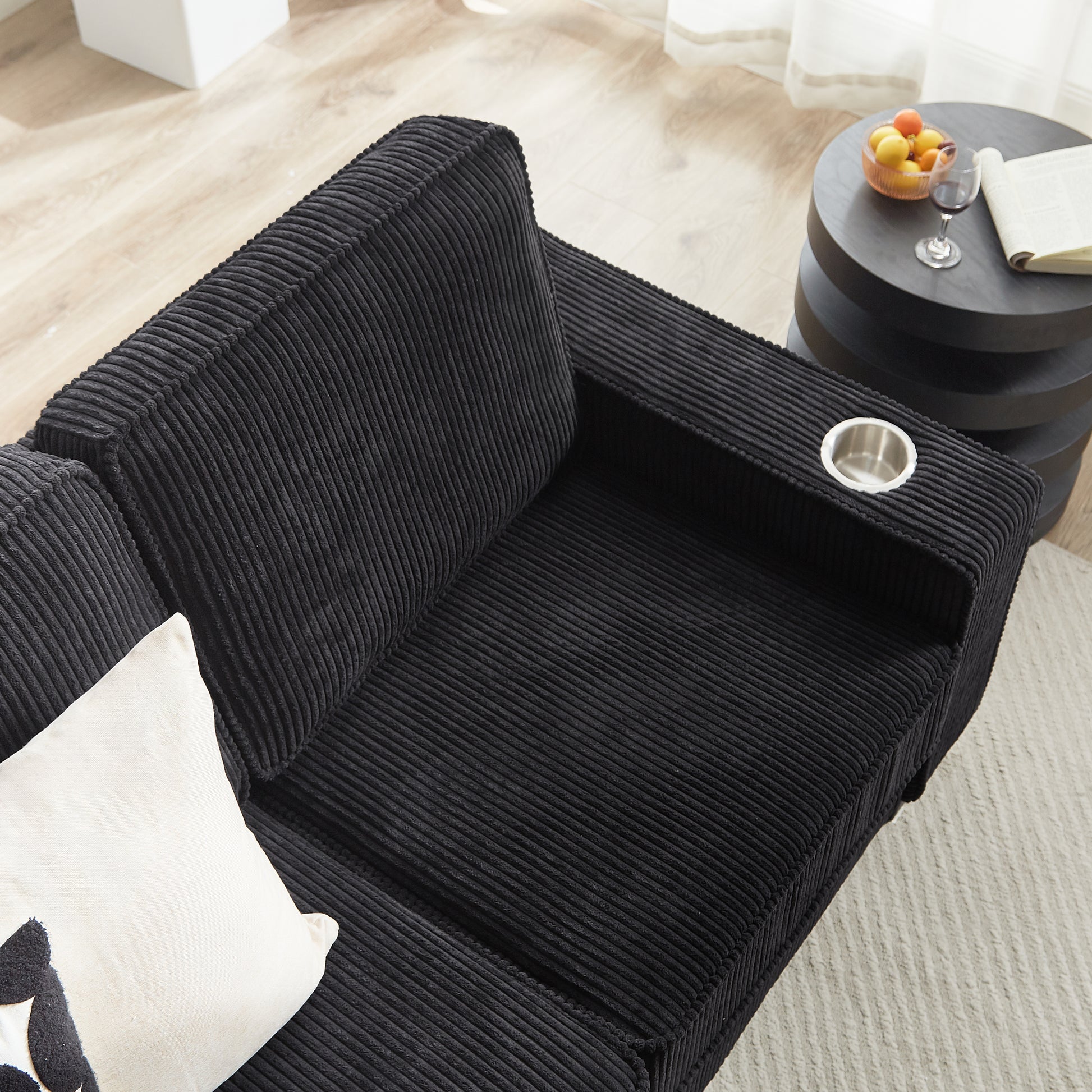 Black corduroy sofa sectional with builtin cup holder for movie nights