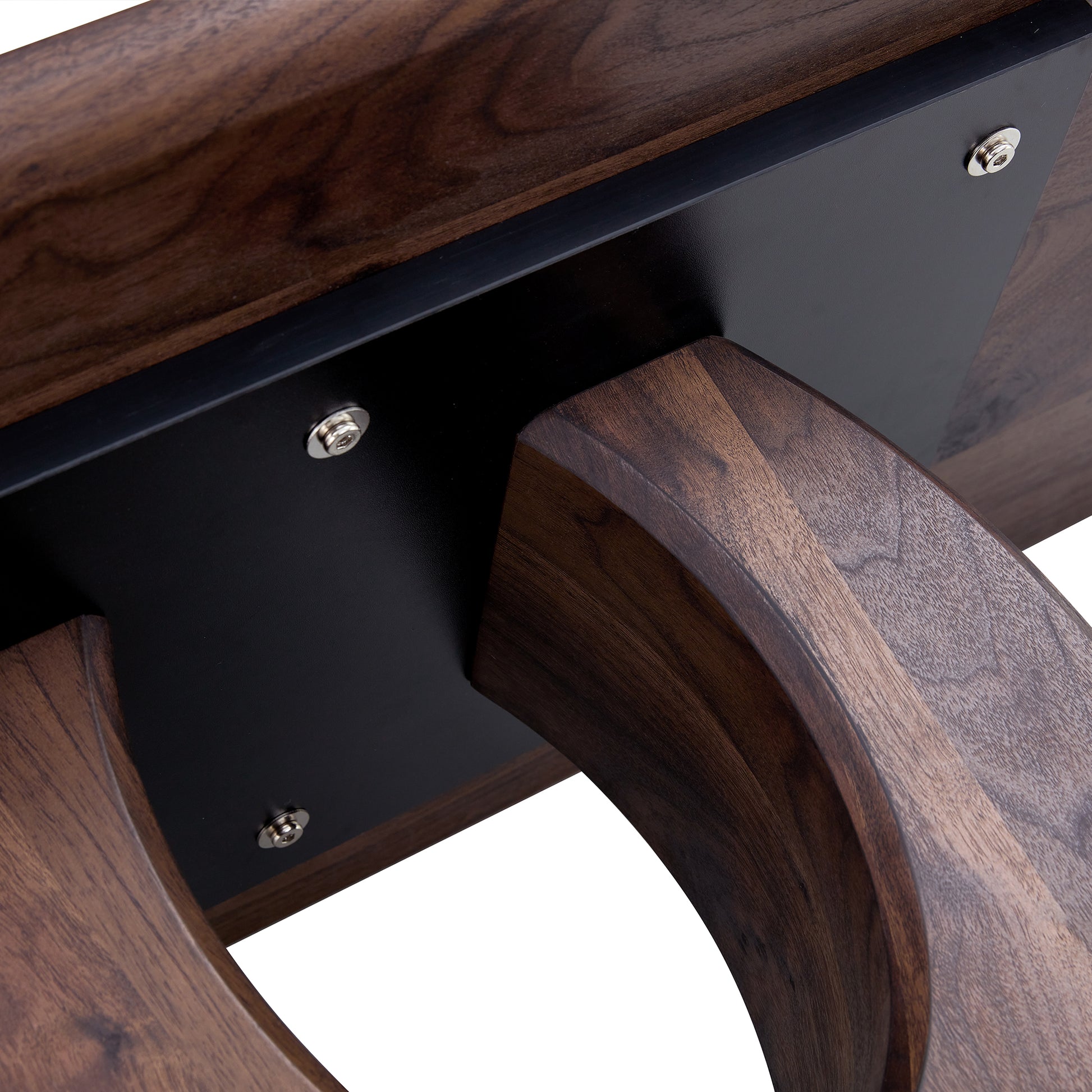 Closeup of dark walnut wood grain on curved furniture legs and black metal support