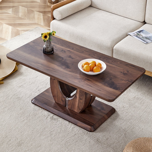 Dark walnut coffee table with curved base and modern design