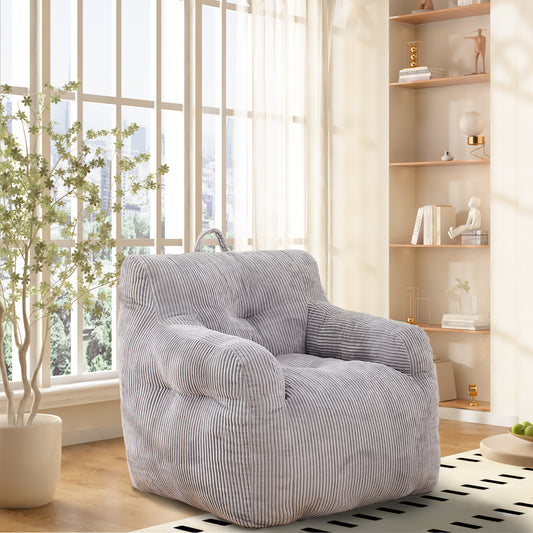 Grey corduroy bean bag chair with tufted seat and armrests