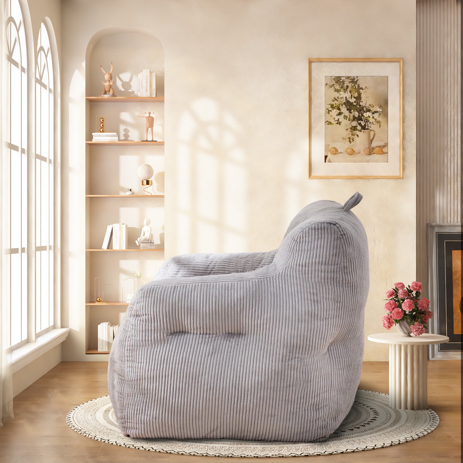 Plush corduroy bean bag chair in light gray offering cozy seating for reading or relaxation