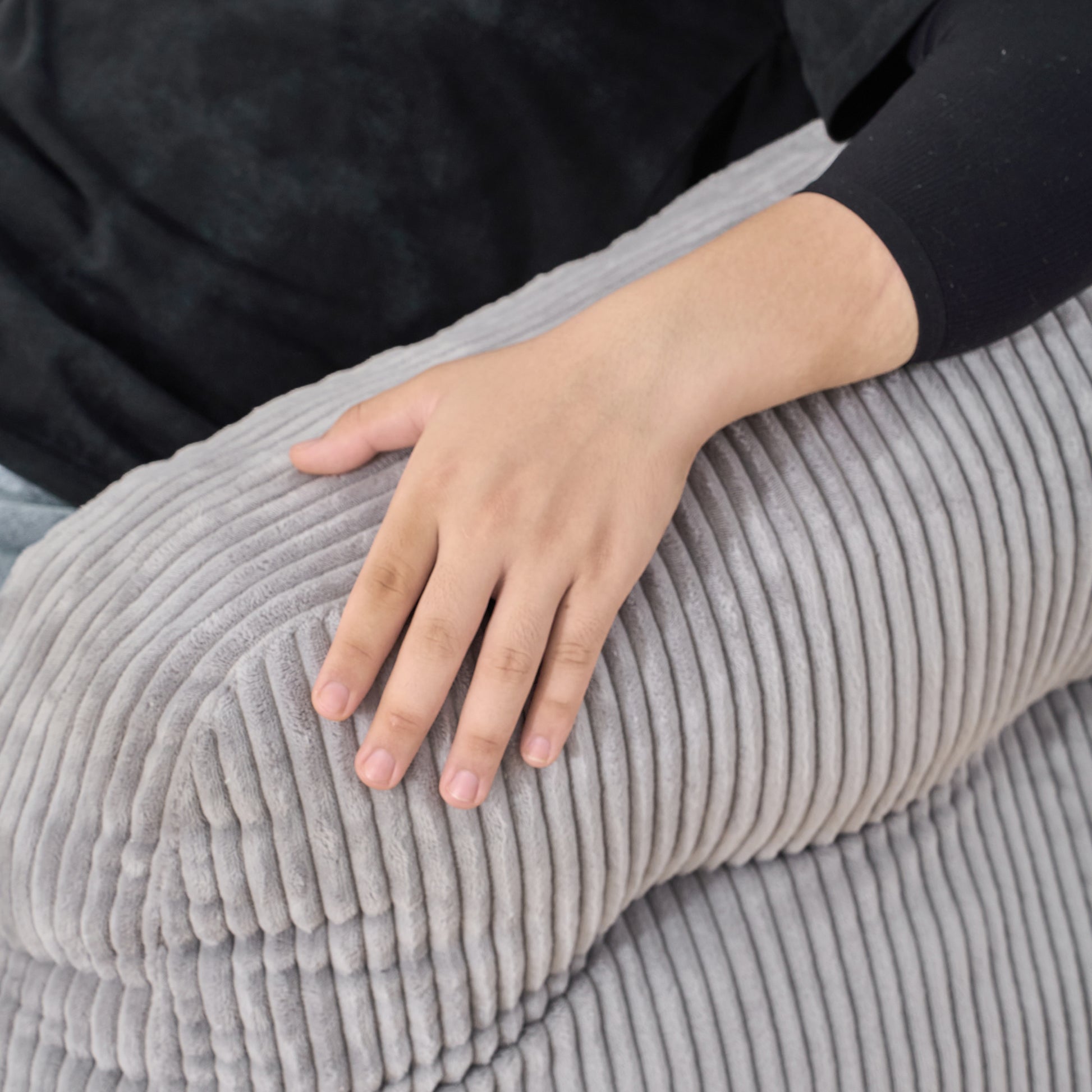 Grey corduroy lumbar pillow with plush texture
