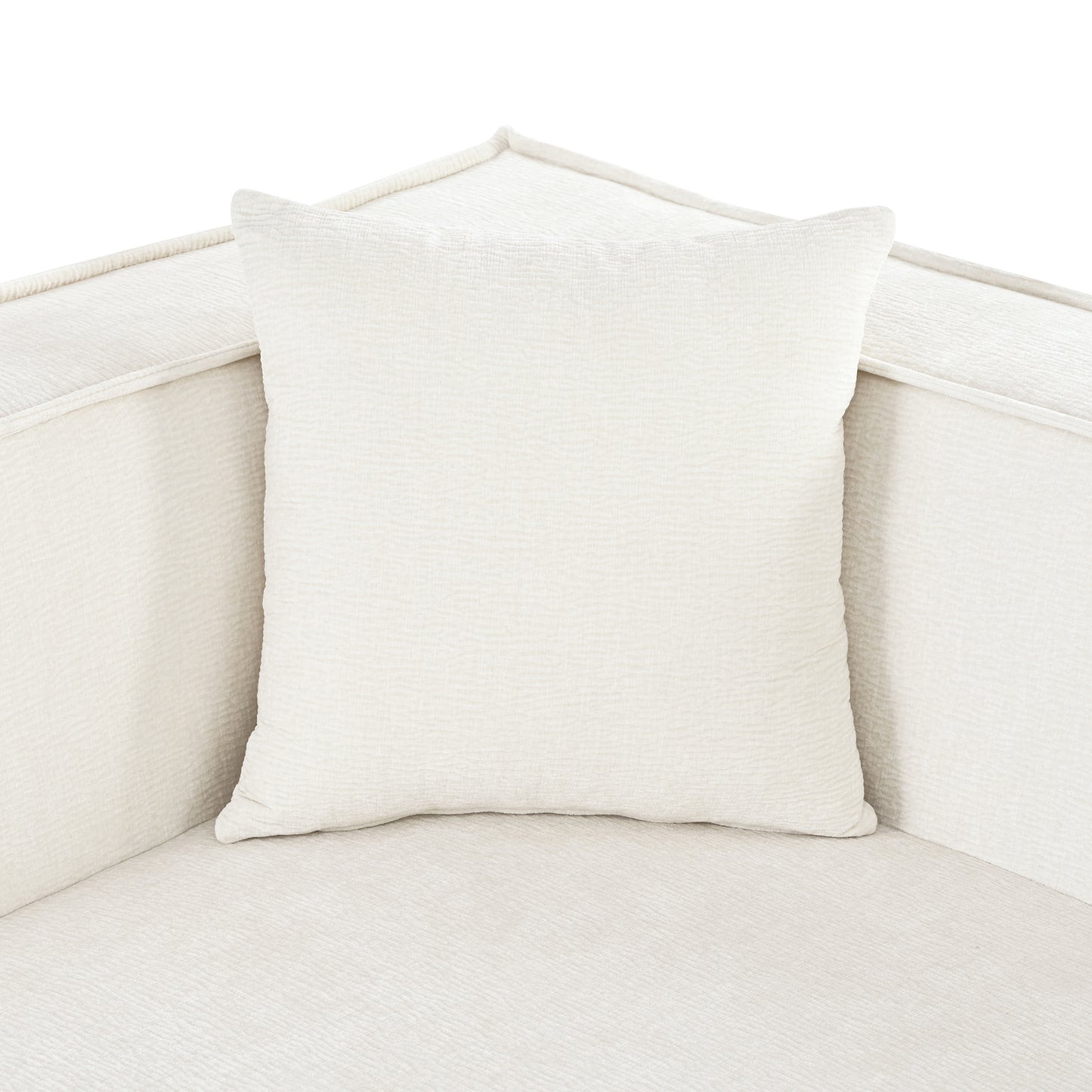 Cream textured throw pillow on sectional sofa
