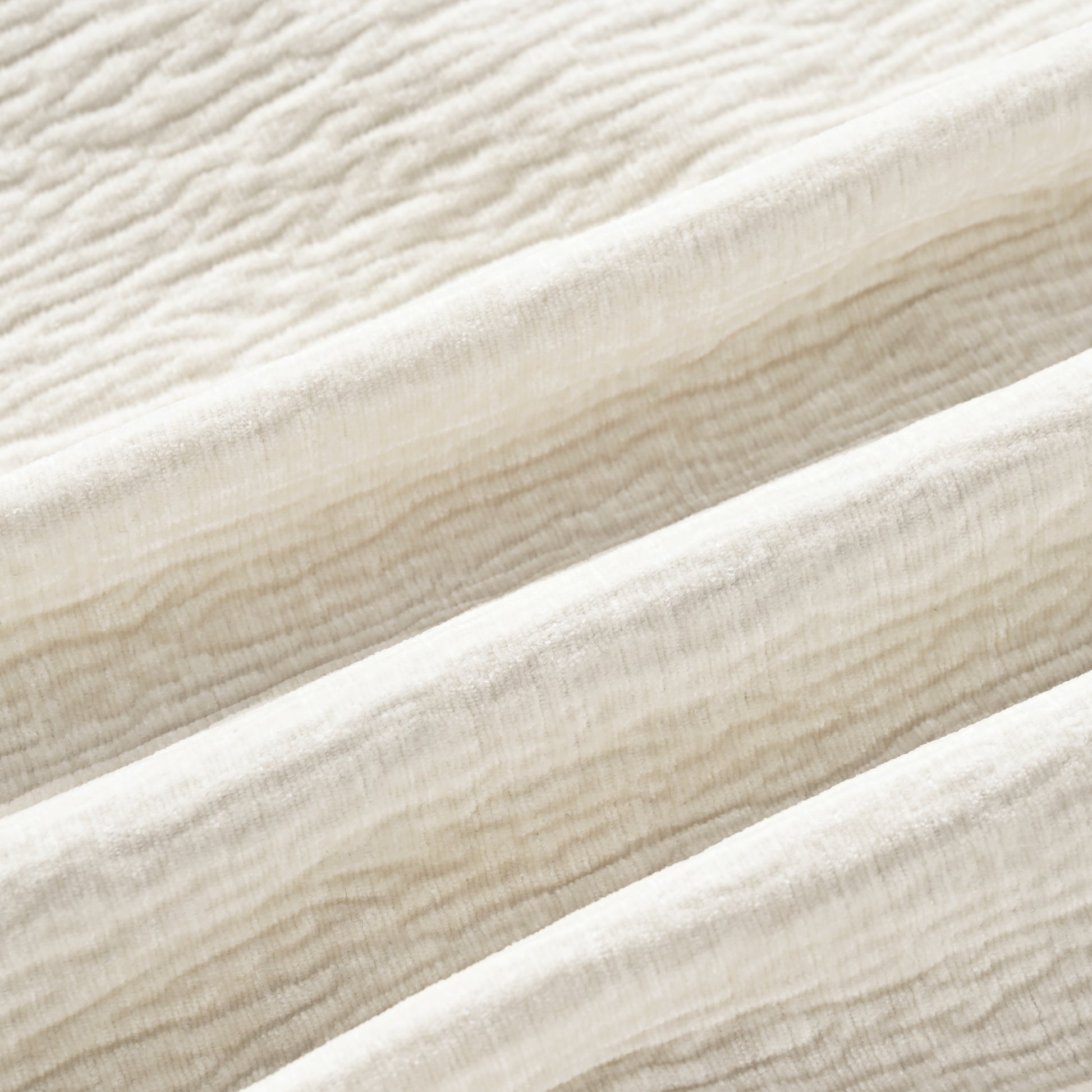 Cream textured chenille fabric draped