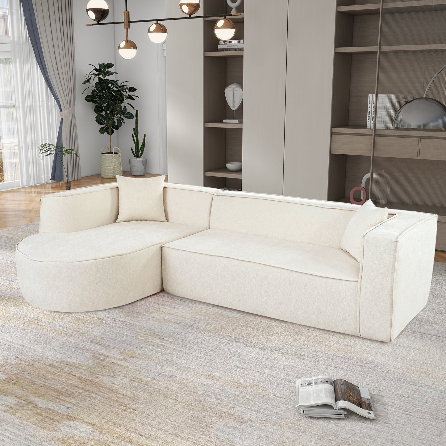 Cream sectional sofa with curved chaise lounge and piped seams