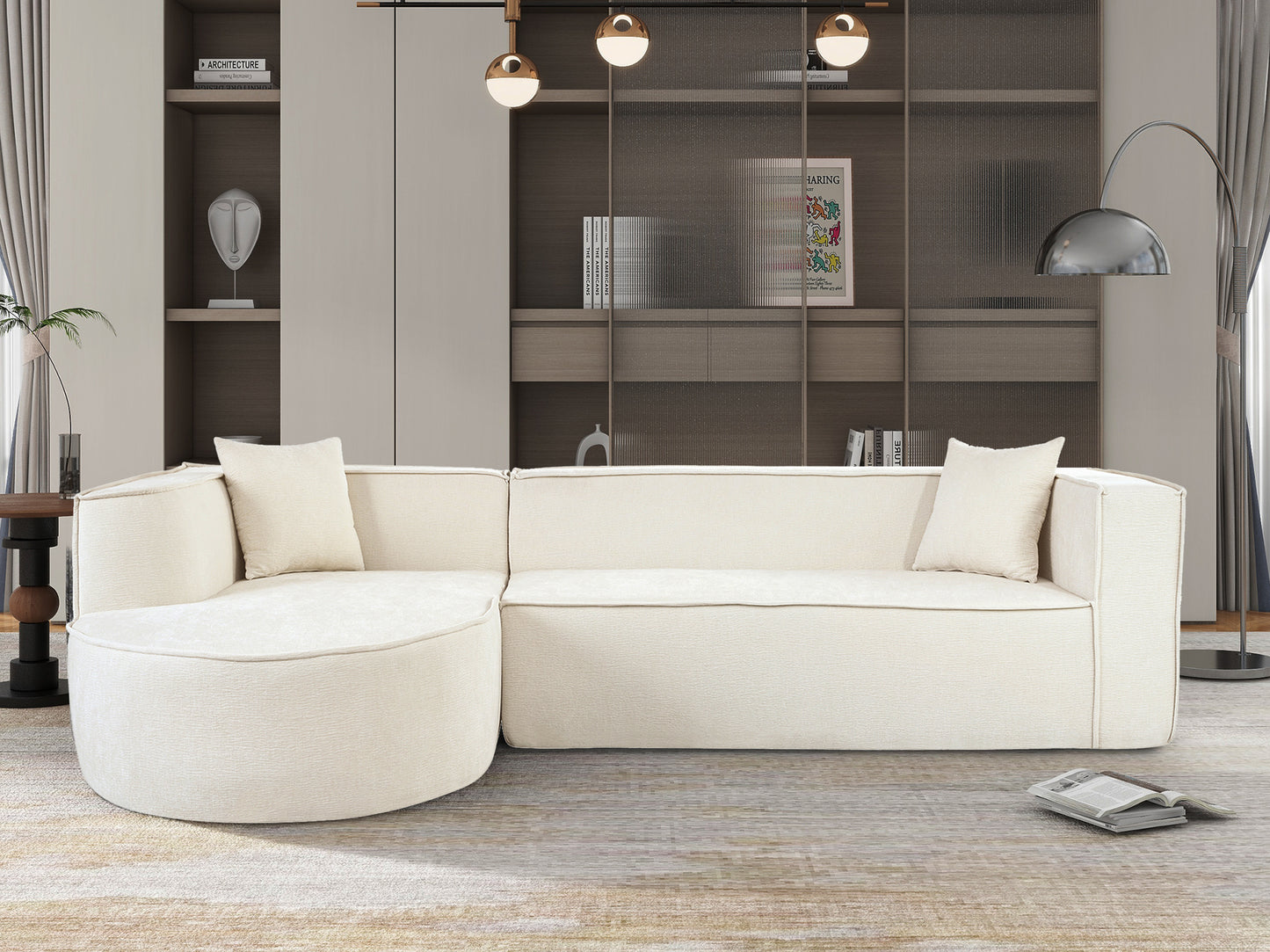 Textured cream fabric sectional sofa with curved chaise and matching pillows