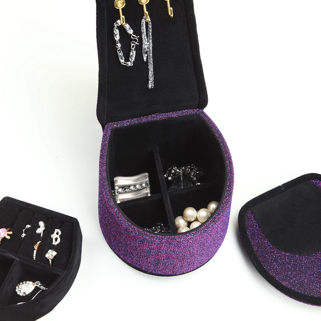 Purple glitter jewelry organizer with silver ring and pearl necklace