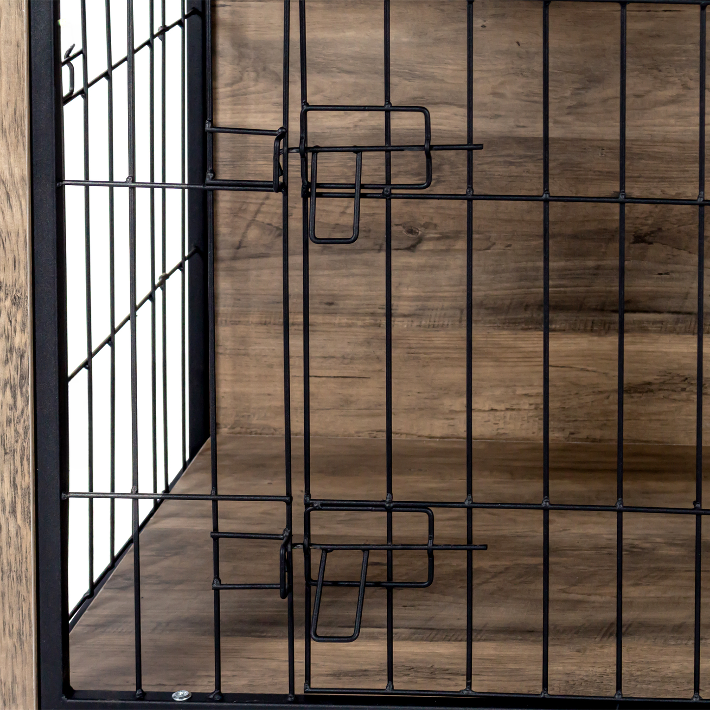 Closeup of black wire mesh door with rustic wood paneling