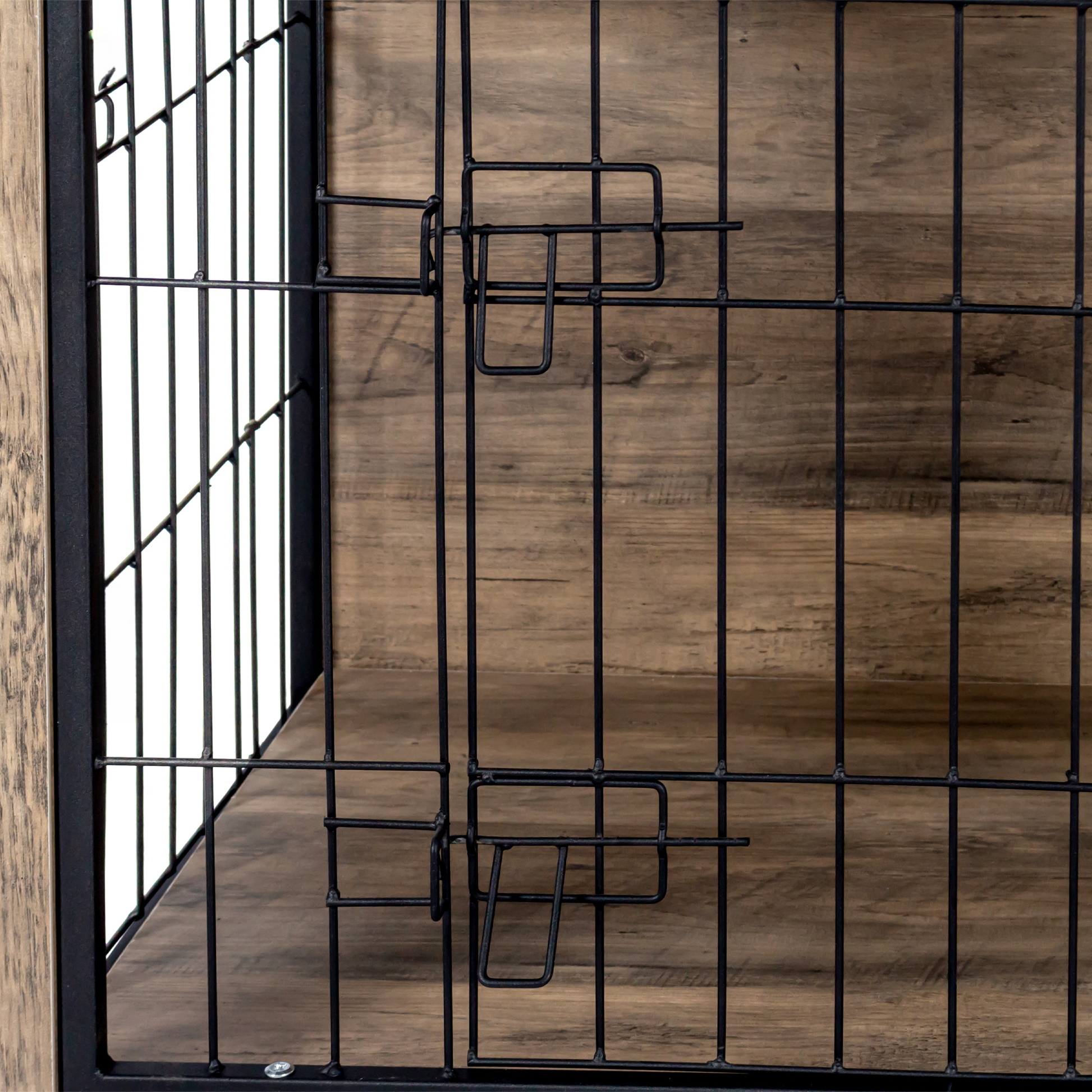 Closeup of black wire mesh door with rustic wood paneling