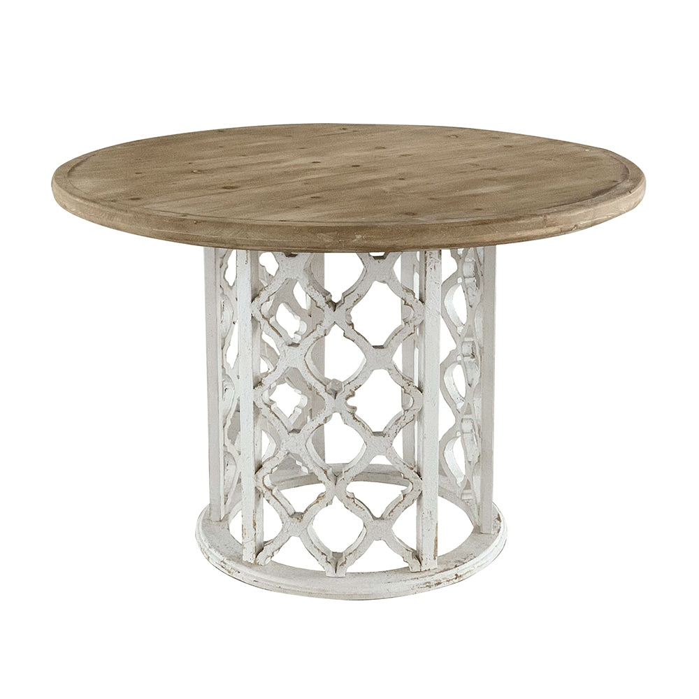 Rustic round dining table with distressed wood top and ornate white base