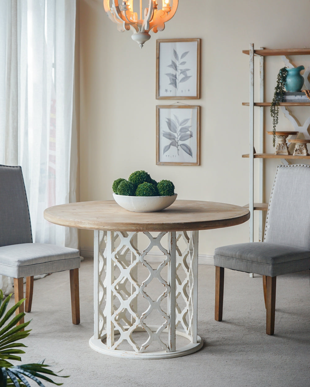 Rustic wood dining table with ornate white base