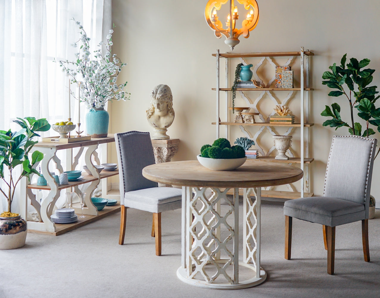 Round wooden dining table with decorative white base