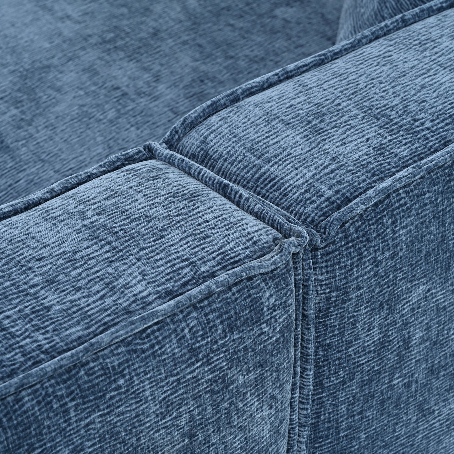 Closeup of textured blue velvet sofa upholstery