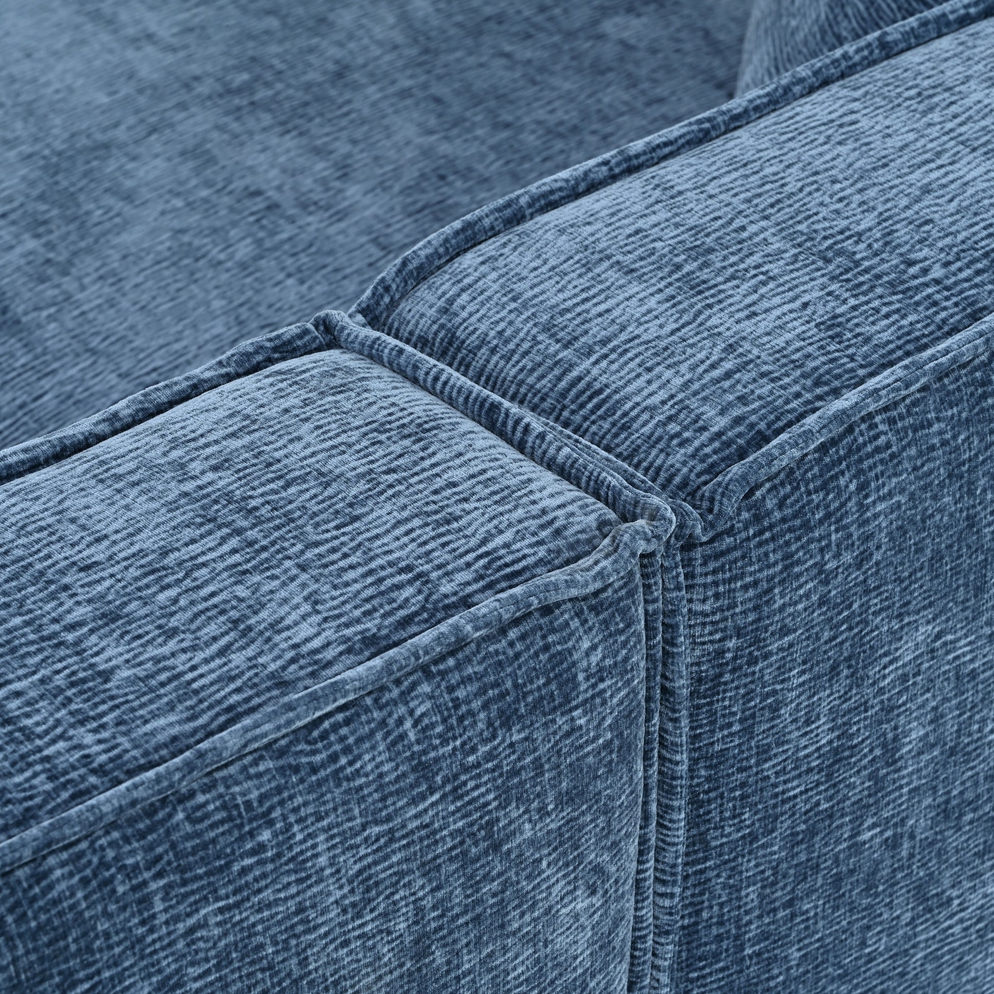 Closeup of textured blue velvet sofa upholstery