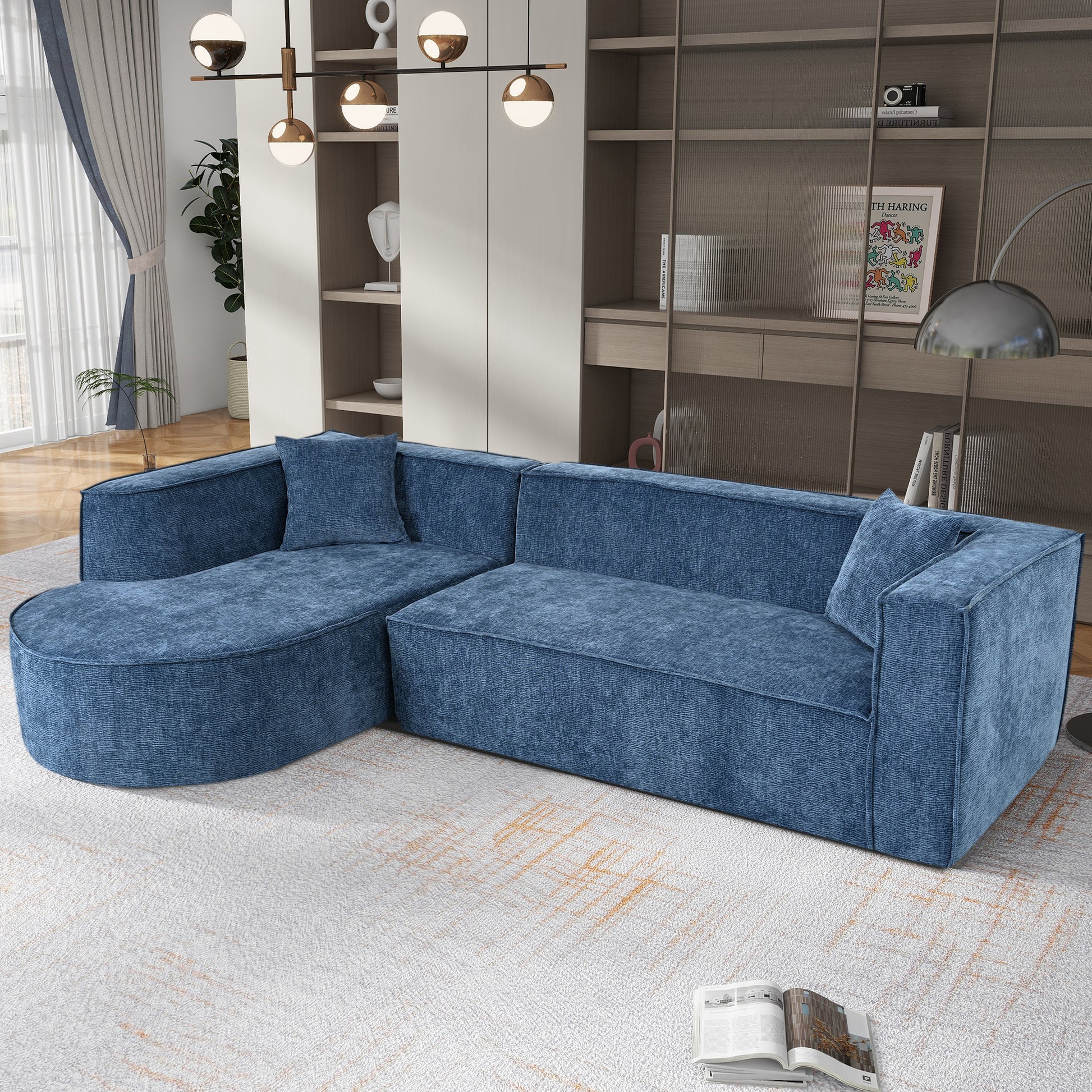 Blue fabric sectional sofa with curved chaise