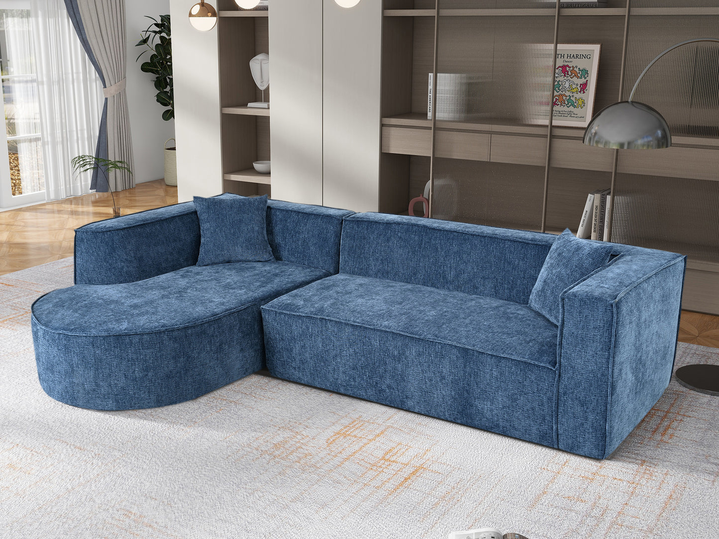 Modern blue fabric sectional sofa with rounded chaise lounge and matching throw pillow