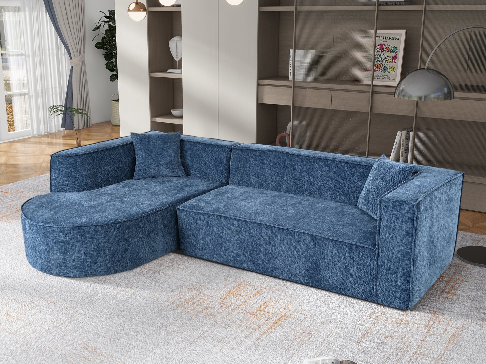 Modern blue fabric sectional sofa with rounded chaise lounge and matching throw pillow