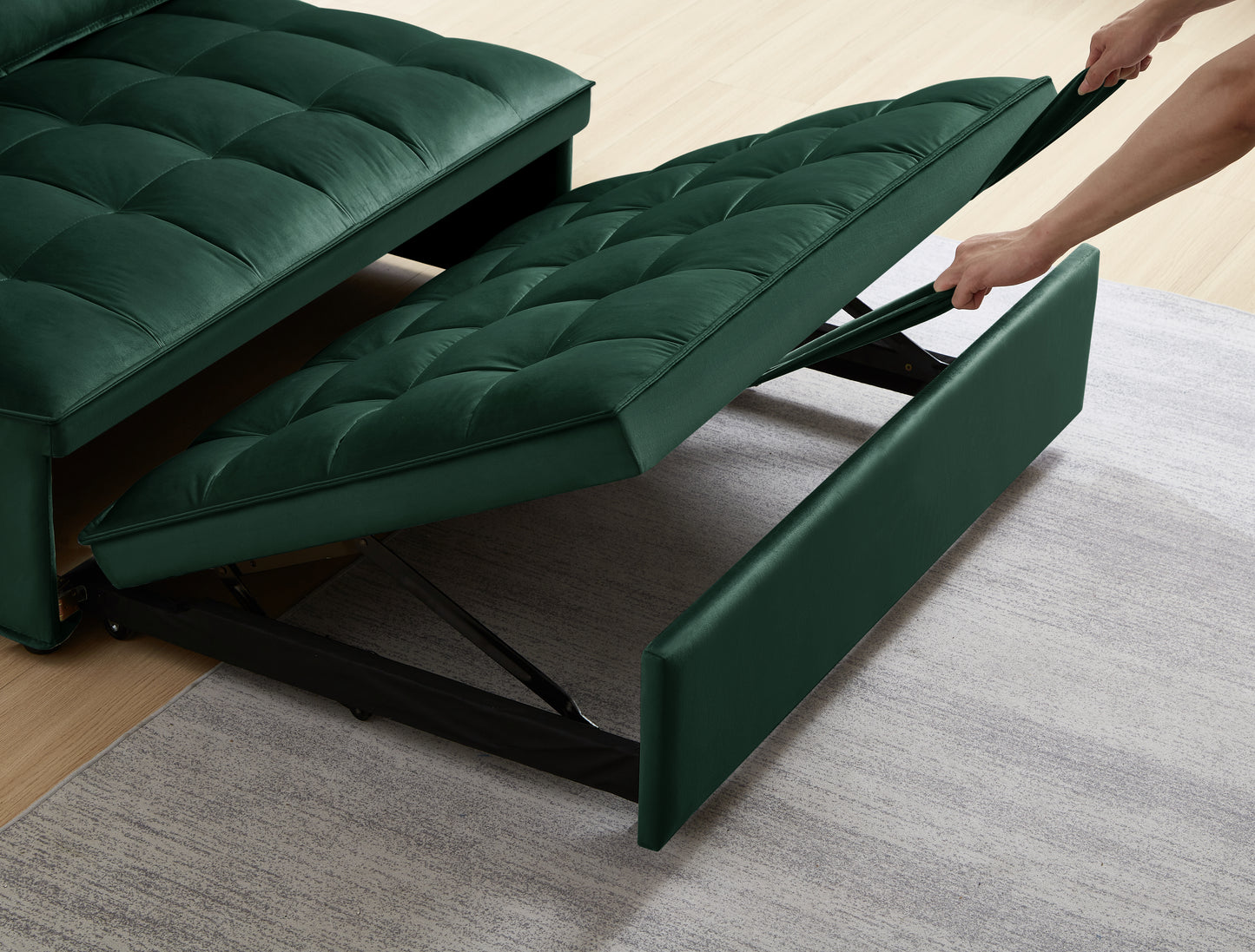 Green velvet tufted sofa bed with pullout mechanism