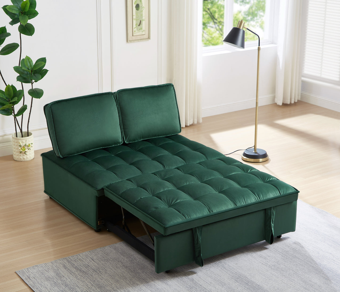 Green velvet sofa bed with tufted cushions and pullout mattress