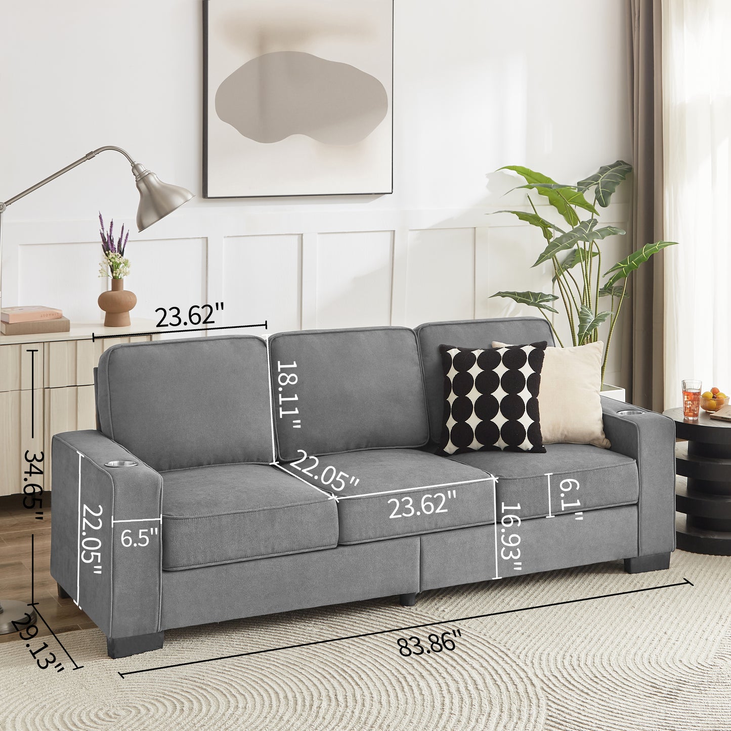 Gray fabric threeseater sofa with builtin cup holders