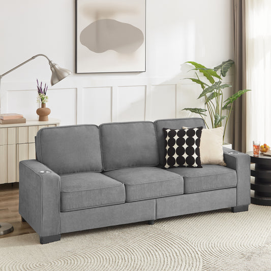 Gray fabric threeseater sofa with builtin cup holders on armrests