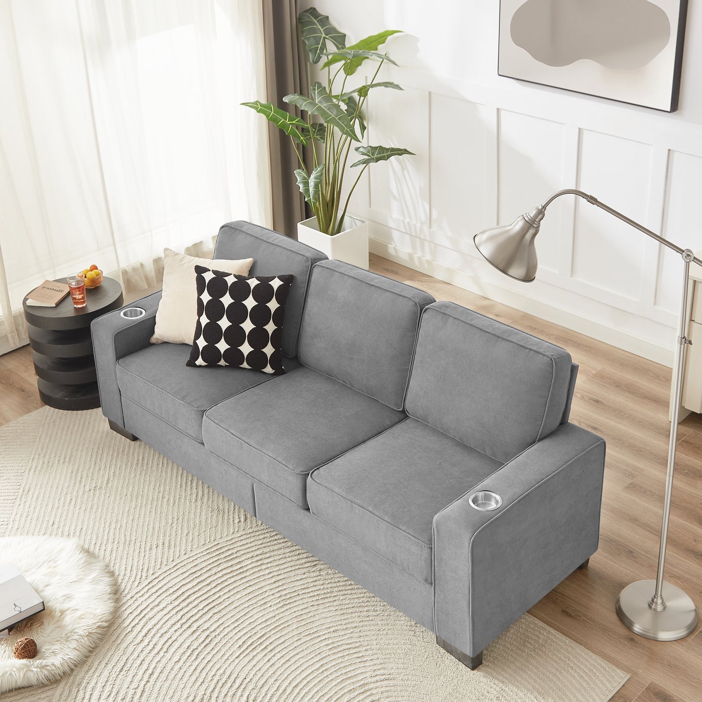 Gray fabric sofa with cup holders
