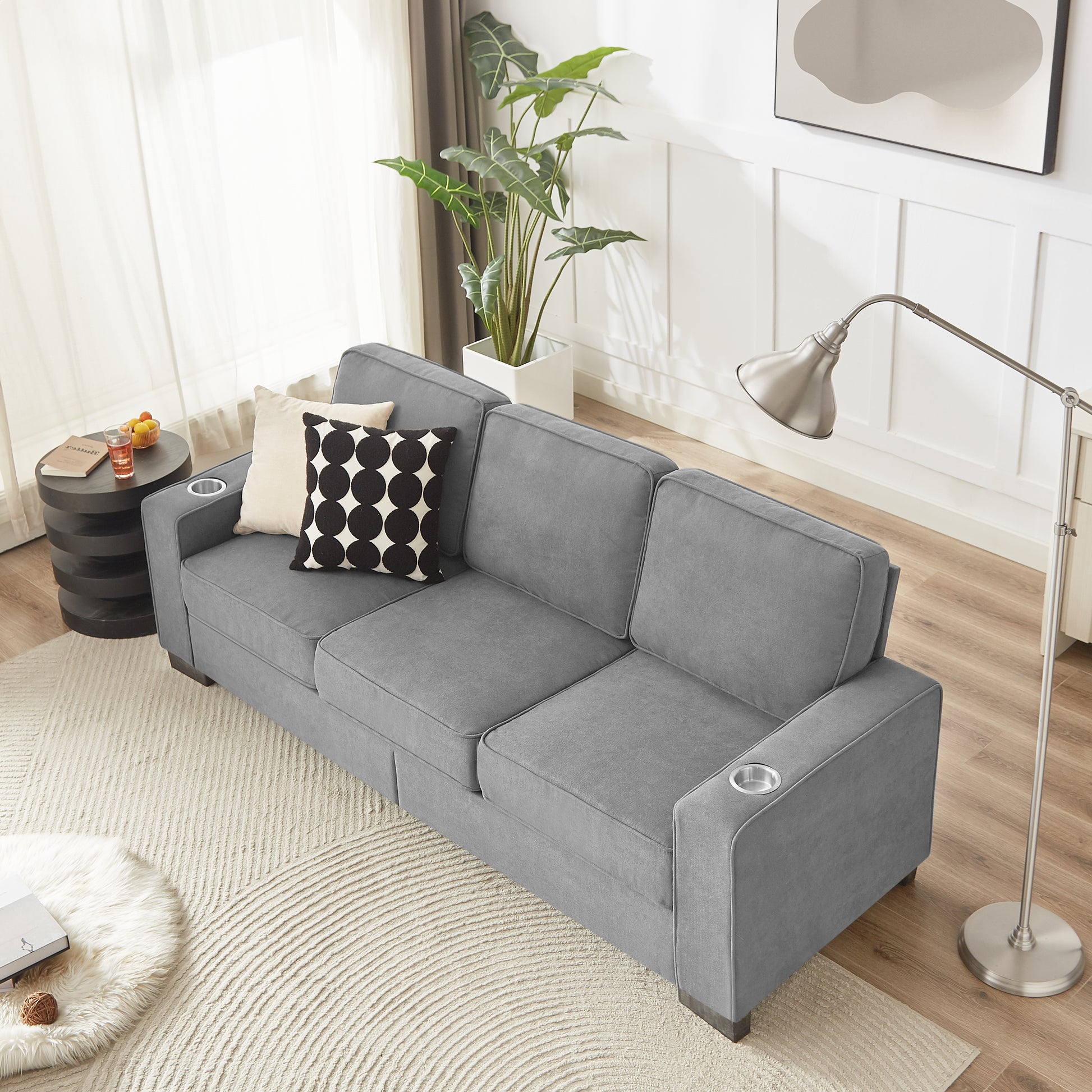 Gray fabric sofa with cup holders