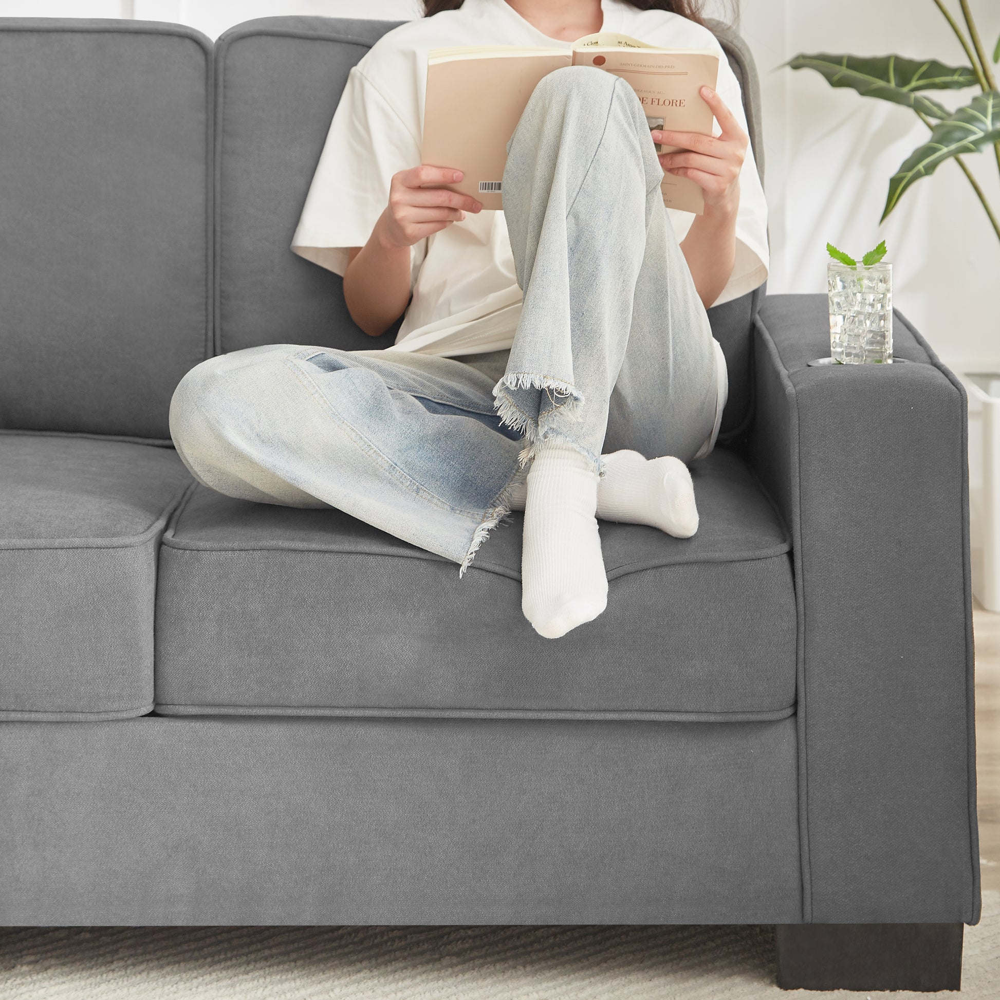 Gray upholstered sofa with a modern design perfect for living rooms