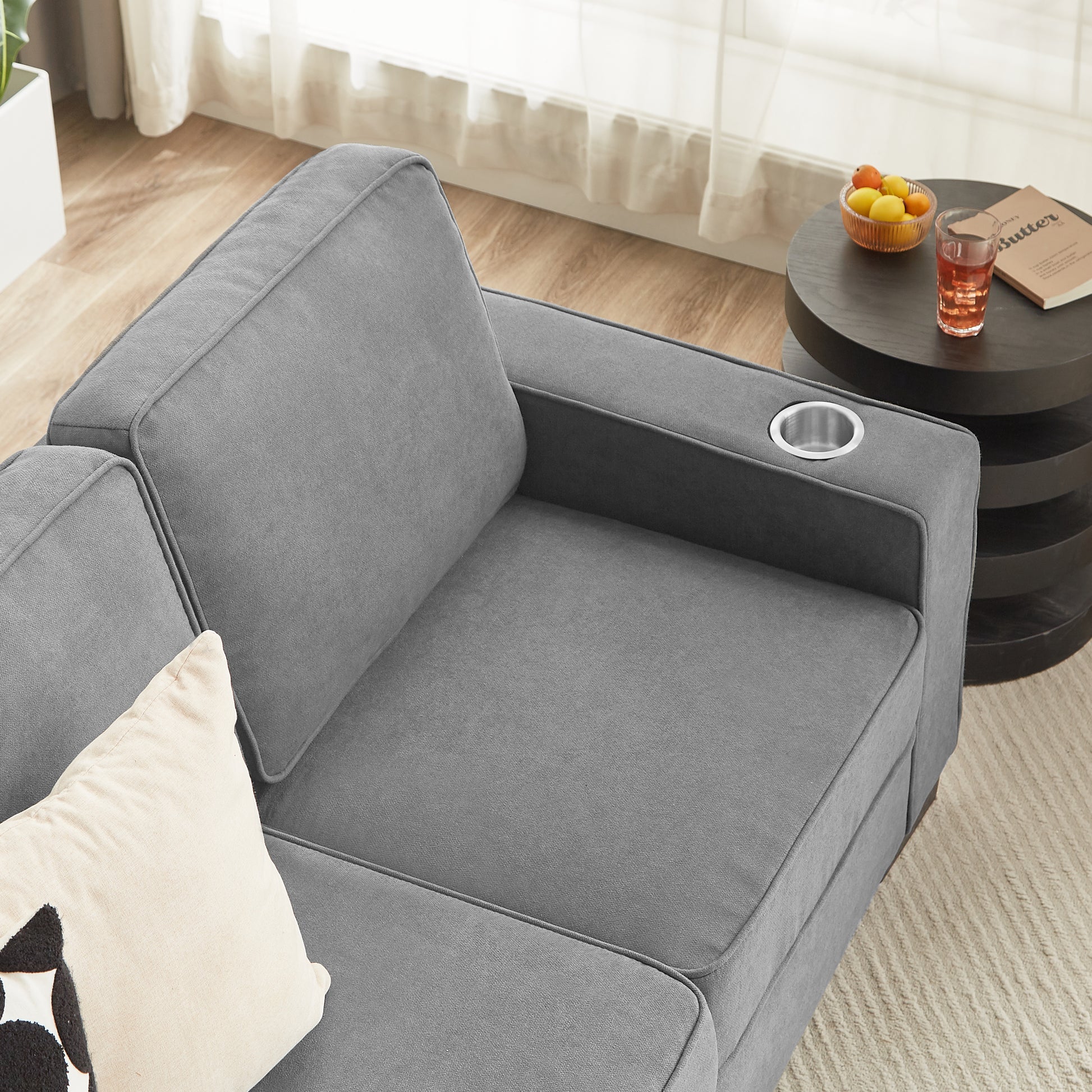 Gray fabric sectional sofa with builtin cupholder