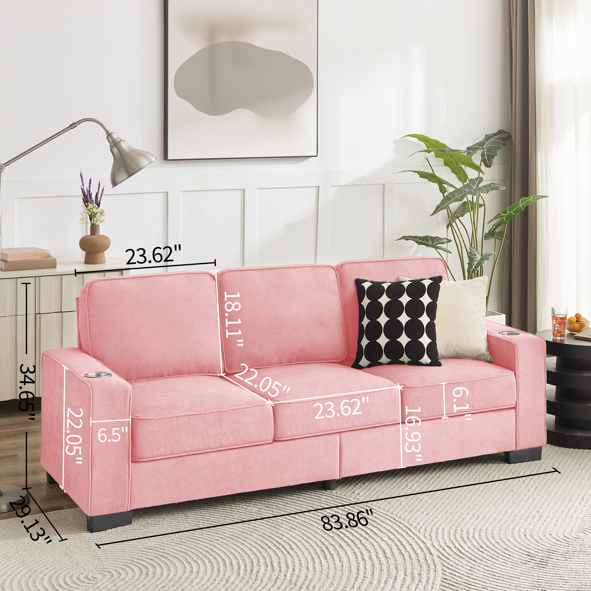 Pink velvet sofa with builtin cup holders