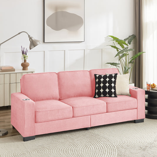 Pink velvet threeseater sofa with builtin cup holders and plush cushions