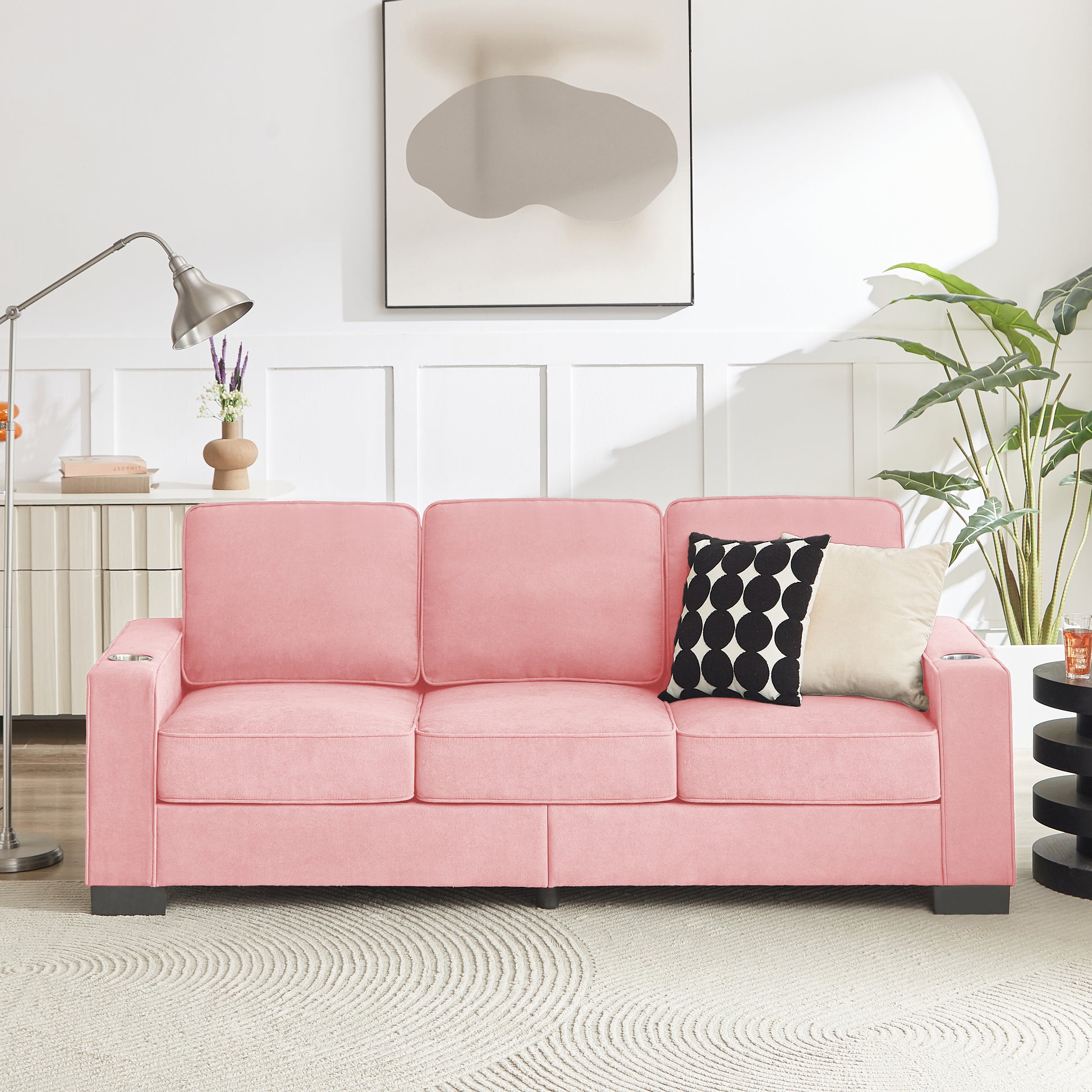 Threeseater pink velvet sofa with builtin cup holders