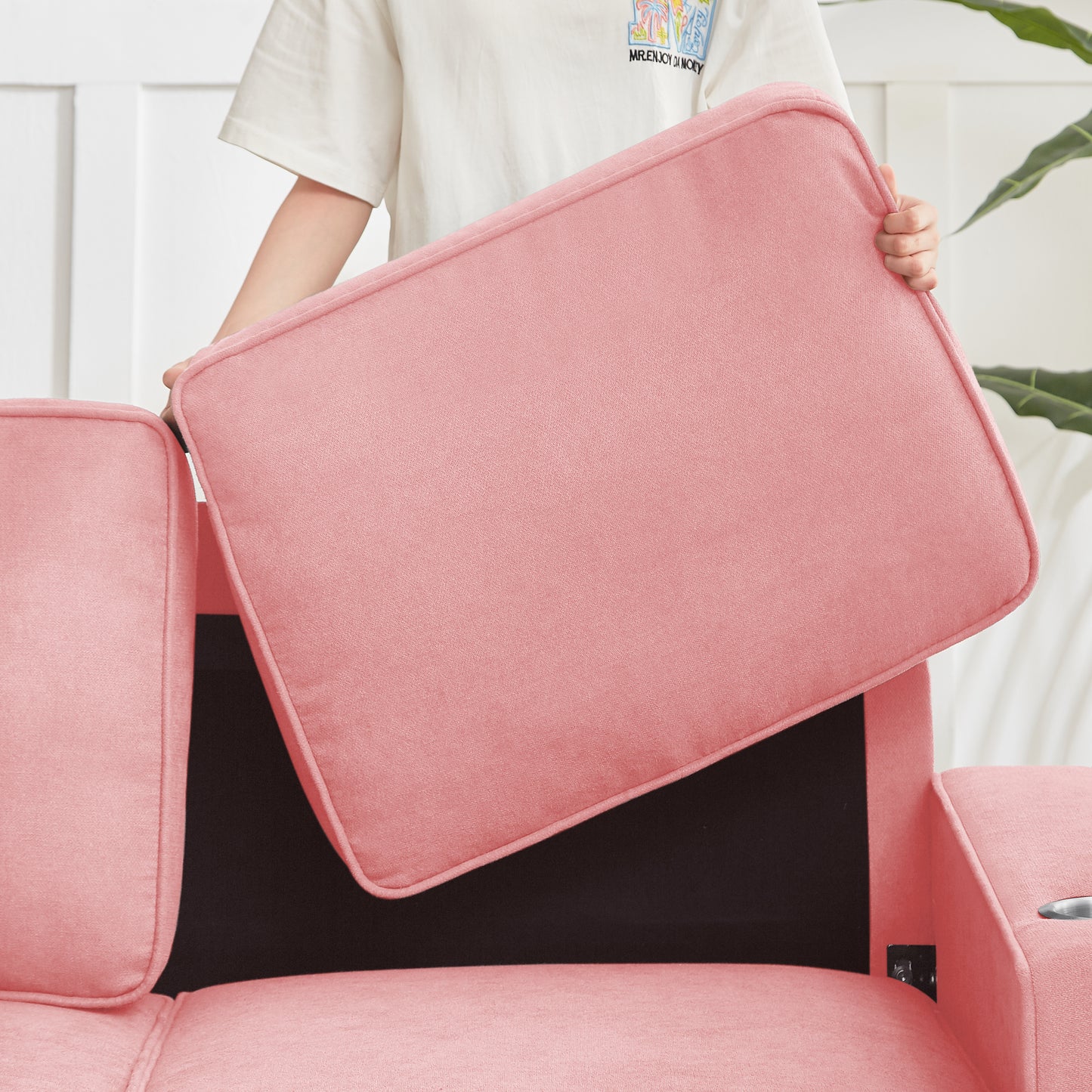 Coral pink plush sofa cushion with piped edges
