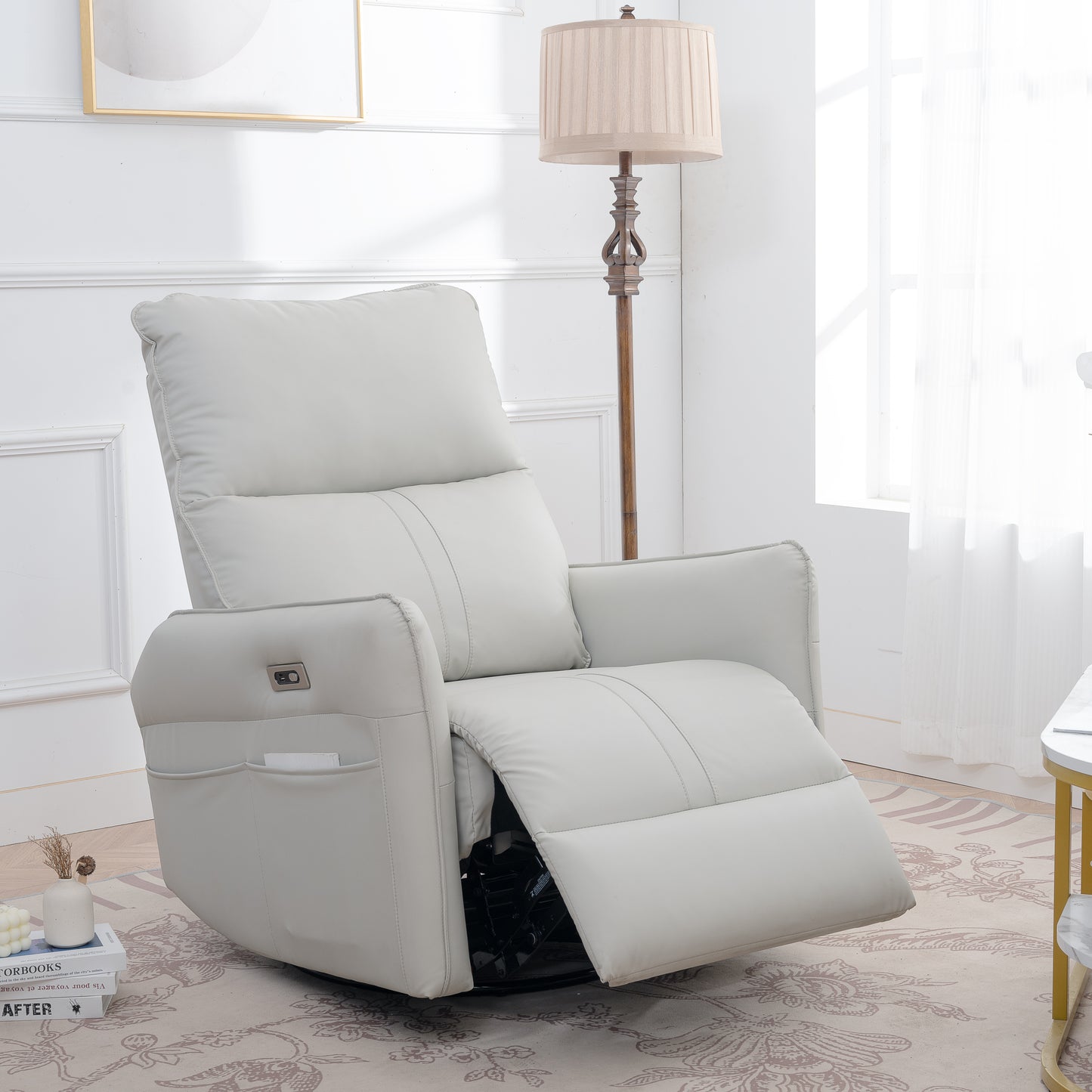 Light gray faux leather swivel recliner with plush cushioning and convenient side pockets