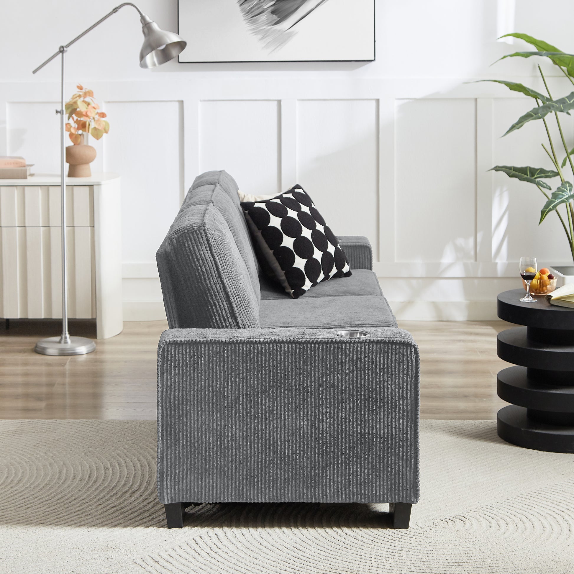 Gray corduroy sofa with builtin cup holder