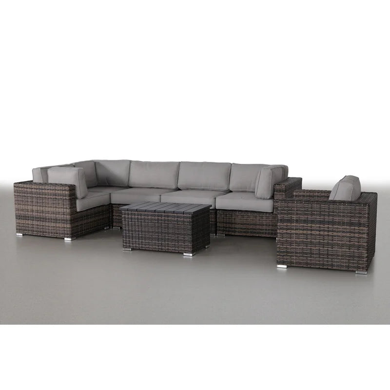 Brown wicker sectional sofa with grey cushions and a dark wood slatted coffee table patio furniture set