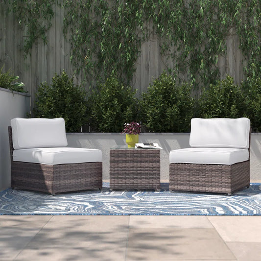 Brown wicker outdoor armchair with white cushion