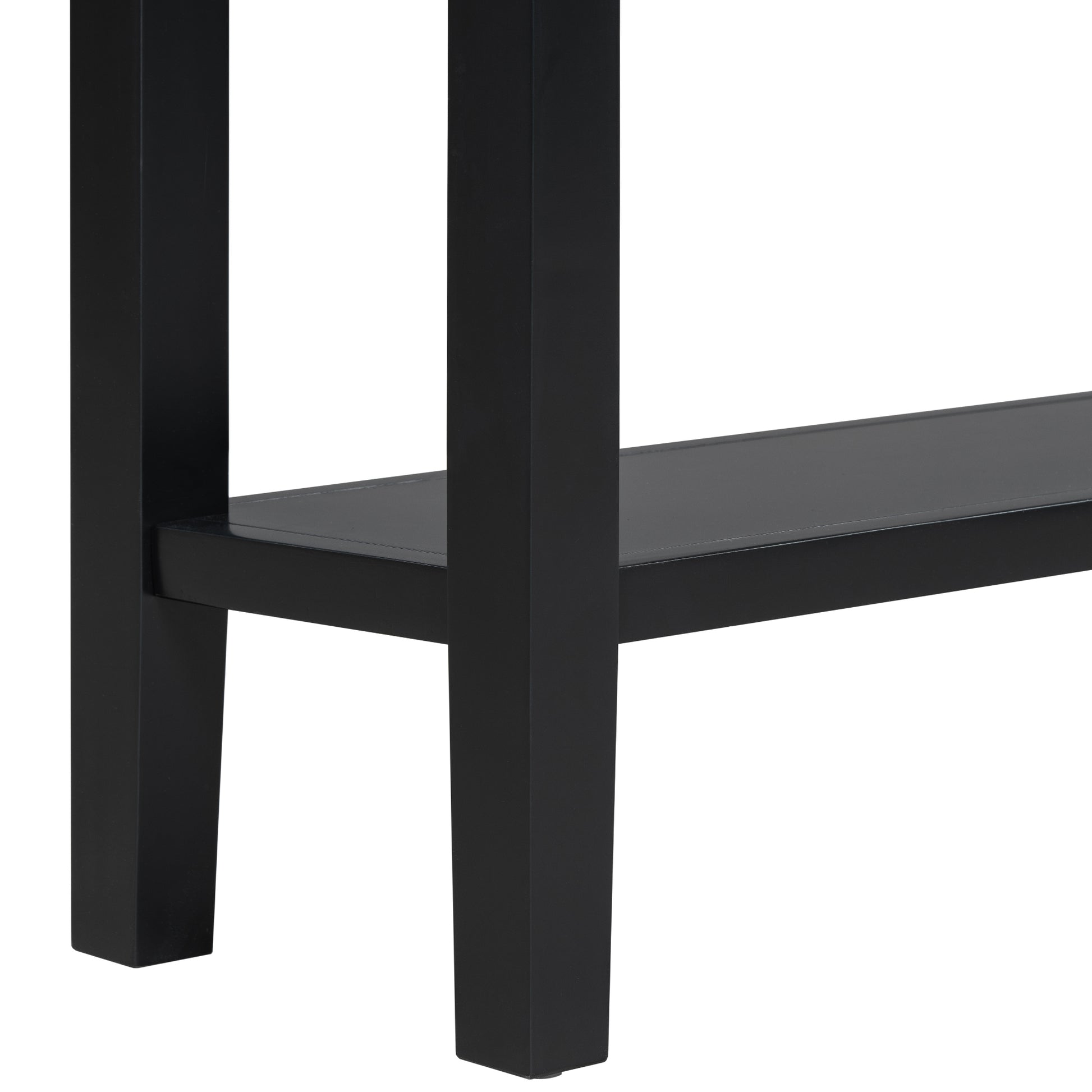 Closeup of black metal console table legs and shelf