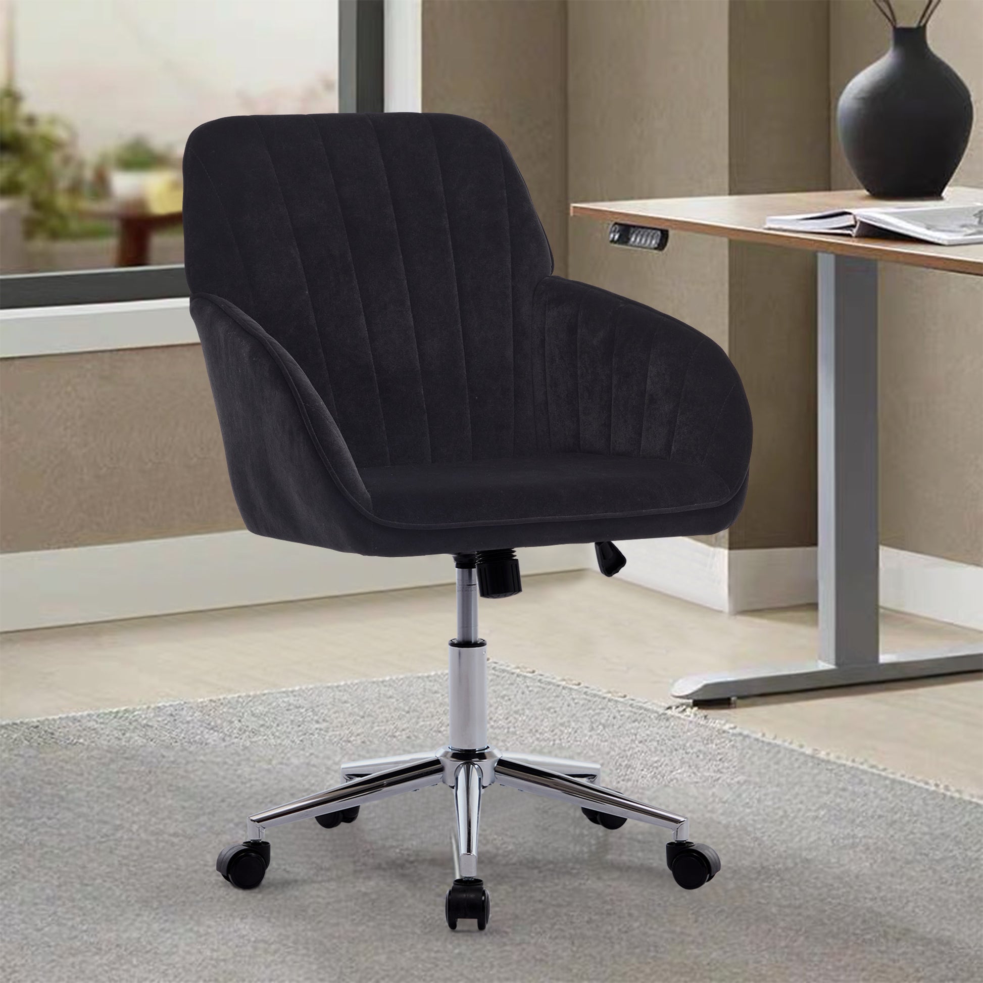 Black velvet executive office chair with padded seat and back