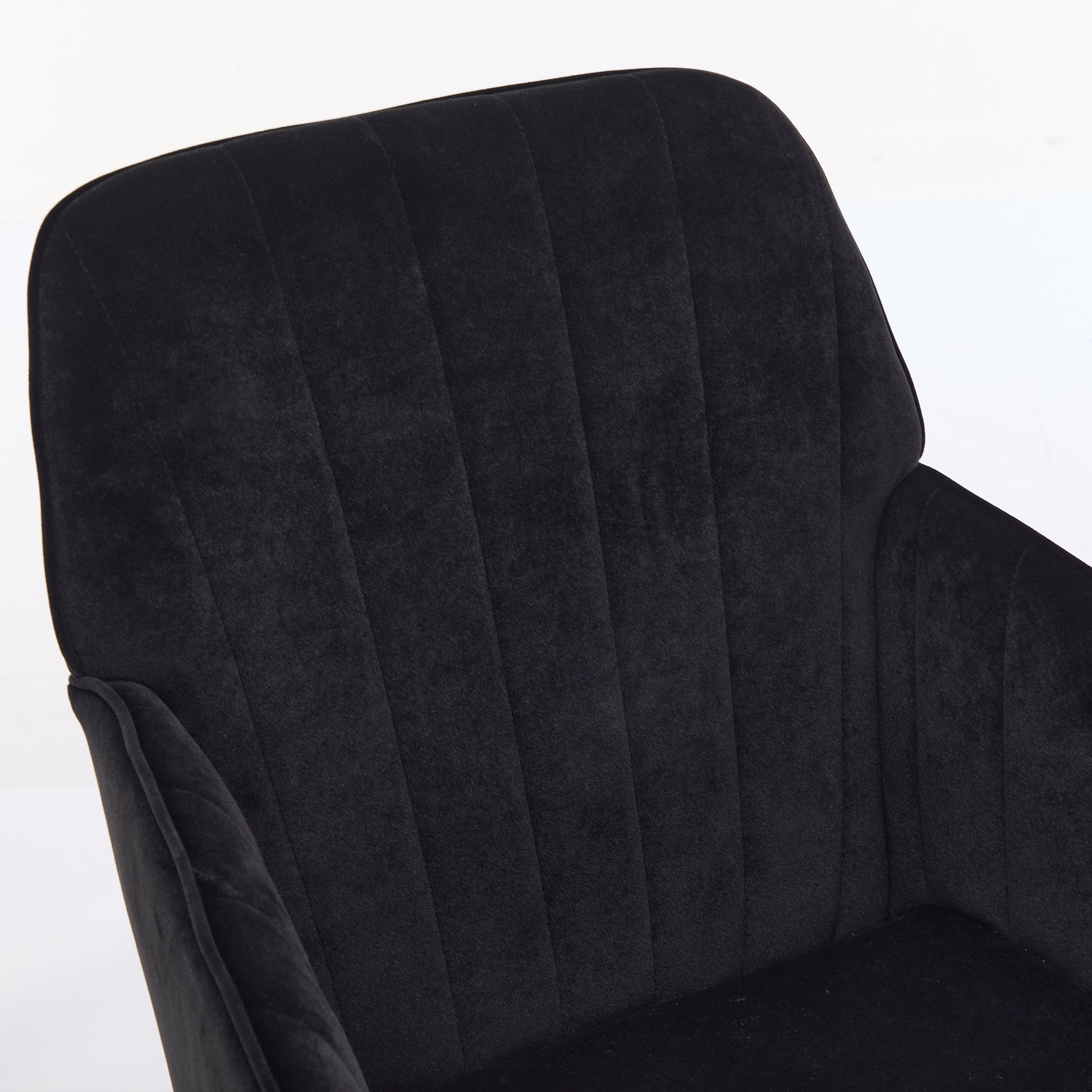 Black velvet accent chair with channel tufting