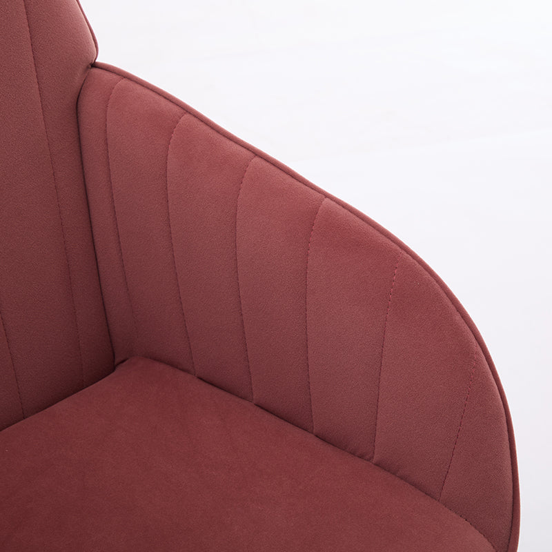 Red velvet accent chair with vertical channel tufting